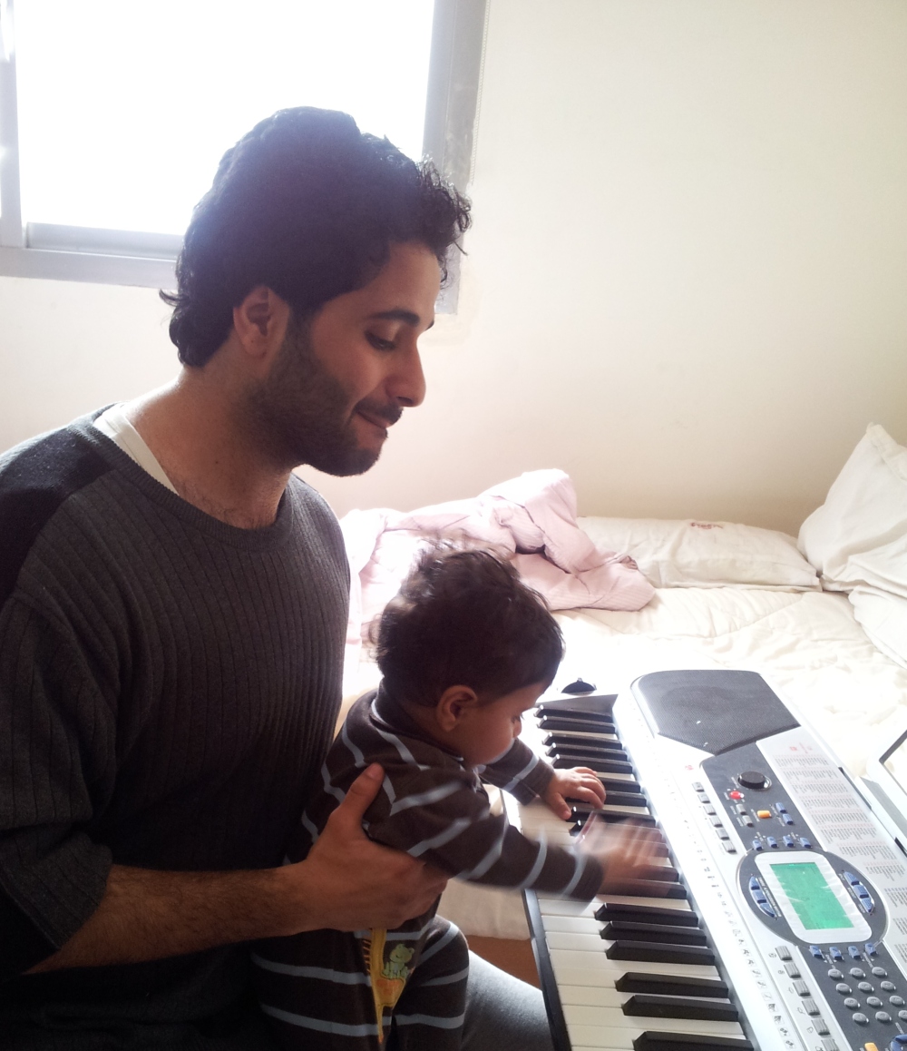 Giving my 8 months old nephew, Ali, his first music lesson...